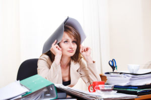 image of woman stressed and needing to fight fatigue naturally